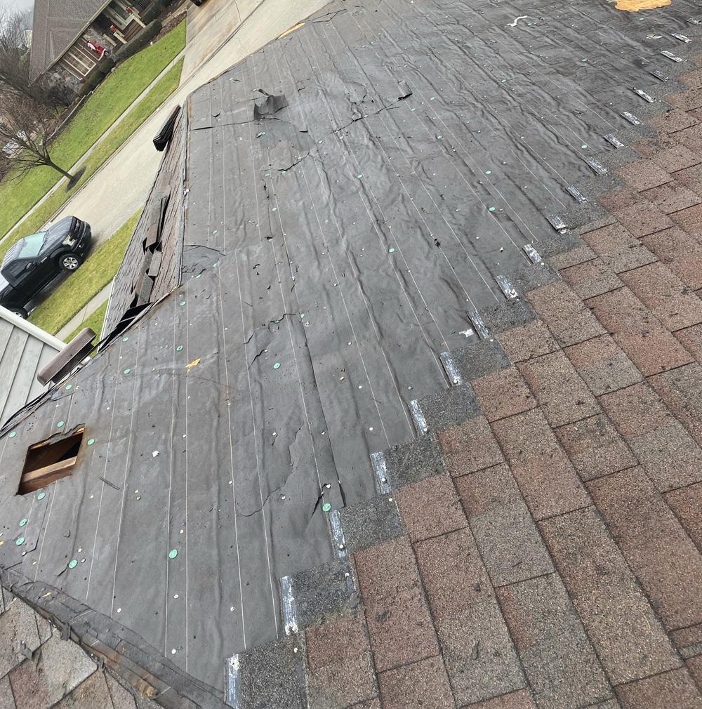 Roof repair fascia shingles chimney leak siding wind damage